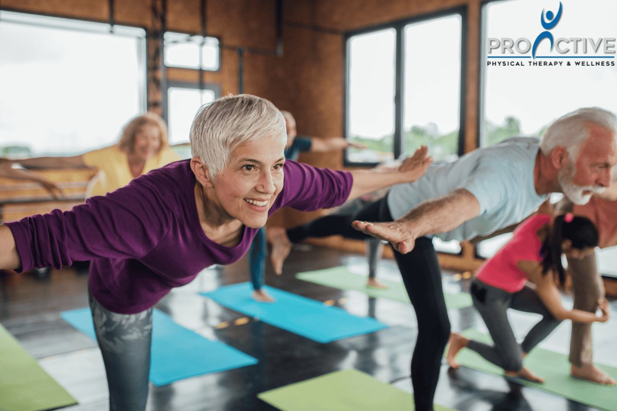 Group of adults over 50 practicing balance exercises in a class at ProActive Physical Therapy and Wellness in Louisville, KY.