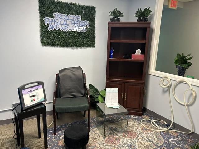 Aura Wave PEMF therapy device set up beside the treatment chair in a ProActive Physical Therapy and Wellness treatment room in Louisville, KY